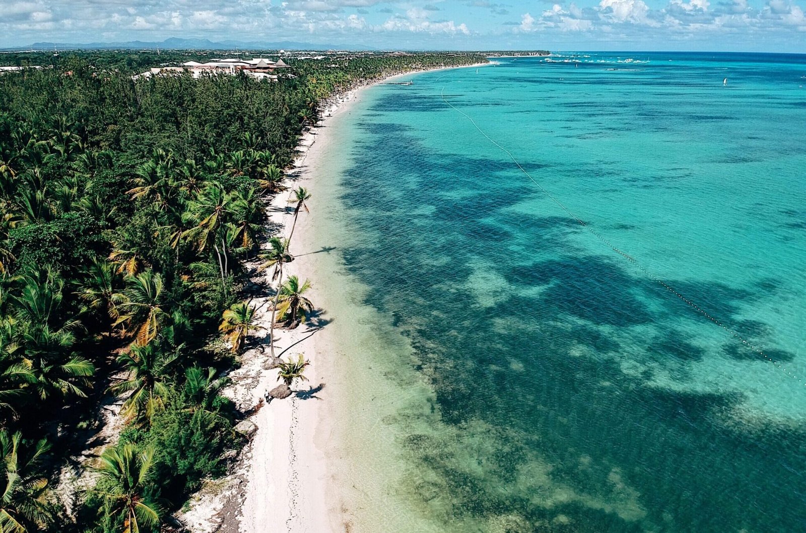top-view-of-beach-and-turquoise-water-2026-03-15-23-29-44-utc